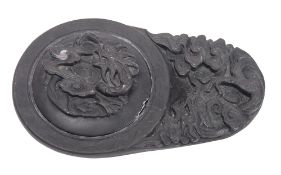 A Chinese Duan inkstone and cover carved with a dragon amongst clouds, 19 x 11cm [chips to cover].