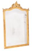 A giltwood and composition framed wall mirror in Rococo Revival taste, mid 19th century,