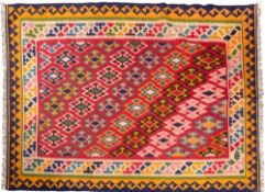 A Qashgai Kelim, the rose field with a diagonal design of geometric medallions,