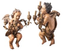 A pair of substantial Continental carved, polychrome and parcel gilt three-light wall appliques
