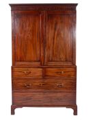 A George III Irish mahogany and inlaid linen press bordered with boxwood lines,
