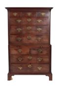 A George III mahogany chest on chest, with a moulded cornice and canted fluted angles,