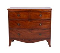 An early 19th century mahogany bow fronted chest,