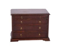 An apprenticeman's mid 18th century rectangular chest, with four long graduated moulded drawers,