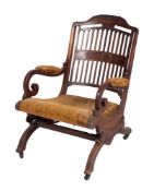 An Edwardian rosewood and inlaid marquetry rocking chair, bordered with boxwood lines,