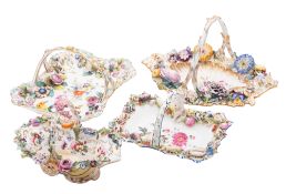 A group of four Coalport flower-encrusted baskets, circa 1830 applied and painted with shells,