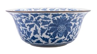 A Chinese porcelain bowl painted in blue with peony and scrolling foliage, 38cm diameter,