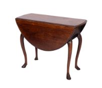 A George II walnut oval drop-flap dining table, the hinged top with a moulded edge,