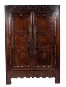 A 19th century French carved walnut and pine armoire,