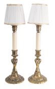 A pair of table lamps modelled as 18th century brass candlesticks,