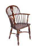 A 19th century elm and fruitwood stickback Windsor elbow chair,