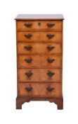 A walnut and crossbanded upright chest of small size in the 18th century style,