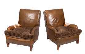 A pair of 1920s beechwood framed and brown leather upholstered armchairs,