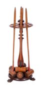 A Victorian mahogany and beechwood croquet set, with four mallets and four balls,