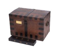 An oak and metal bound domed silver chest, with twin iron carrying handles,