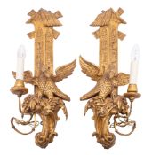 A pair of carved giltwood single light wall appliques in Rococo taste,