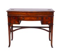 A contemporary hardwood serpentine fronted campaign style writing desk,