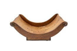 A George III mahogany cheese coaster, early 19th century; of typical dished rectangular form,