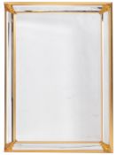 A pair of Contemporary giltwood framed rectangular marginal wall mirrors,