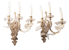 A pair of fine gilt metal and cut glass three-light wall appliques,
