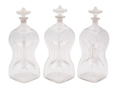 Three 'glug glug' clear glass decanters,