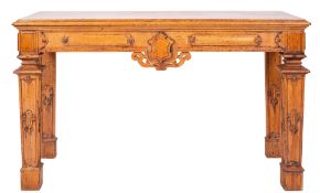 A late 19th century oak rectangular serving table with a moulded top and panelled frieze with