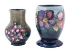 Two Walter Moorcroft pottery vases comprising a footed oviform example,