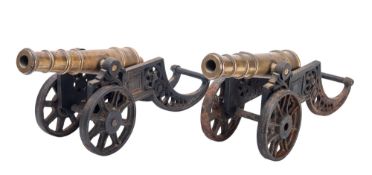 A pair of late Victorian brass and iron models of field cannon,