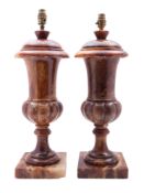A pair of stained alabaster urn table lamps,