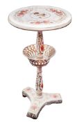 A pottery two-tier occasional table,