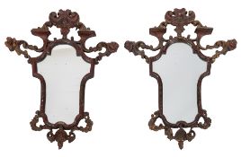 A pair of 19th century Italian carved wood and decorated cartouche shaped wall mirrors,
