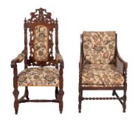 A late Victorian carved oak open arm chair,