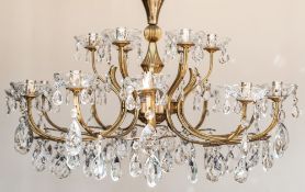 A gilt metal and glass eighteen light chandelier,