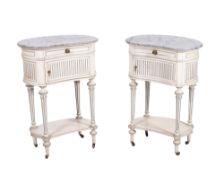 A pair of French decorated bedside cabinets in the Louis XVI taste,