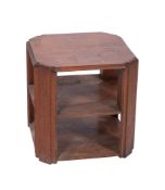 A 1930's oak octagonal three tier book table, in the manner of Heal and Co, 46cm across, 47cm high.