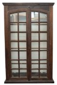 A 19th Century French oak and pine display cabinet, with a moulded cornice,