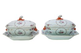 A pair of large Chinese Export famille rose octagonal tureens, covers and stands,