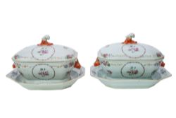 A pair of large Chinese Export famille rose octagonal tureens, covers and stands,