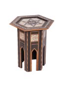 A Near Eastern ebonised and inlaid mother of pearl hexagonal occasional table,