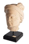 A sculpted white marble fragmentary head of a man,