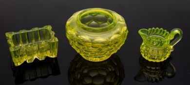 Three pieces of pressed uranium glass