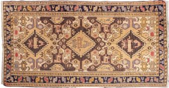 A Sumak Kelim, the beige field with triple hooked lozenge medallions,