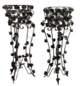 A near pair of painted wrought iron jardiniere stands,