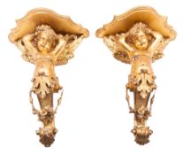 A pair of giltwood and composition figural wall brackets in Rococo revival taste,