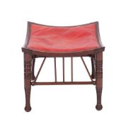 A Liberty mahogany 'Thebes stool', the upholstered square saddle seat with a reeded edge,