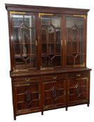A Maple and Co. Edwardian mahogany and brass mounted library bookcase