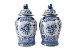 A pair of large Chinese blue and white baluster vases and covers,