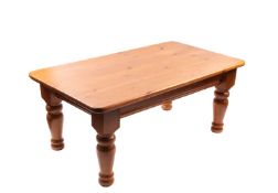 A modern pine rectangular coffee table.