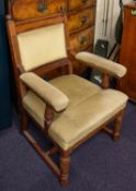 An Edwardian walnut open armchair, the u