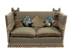 A green upholstered Knole sofa,
